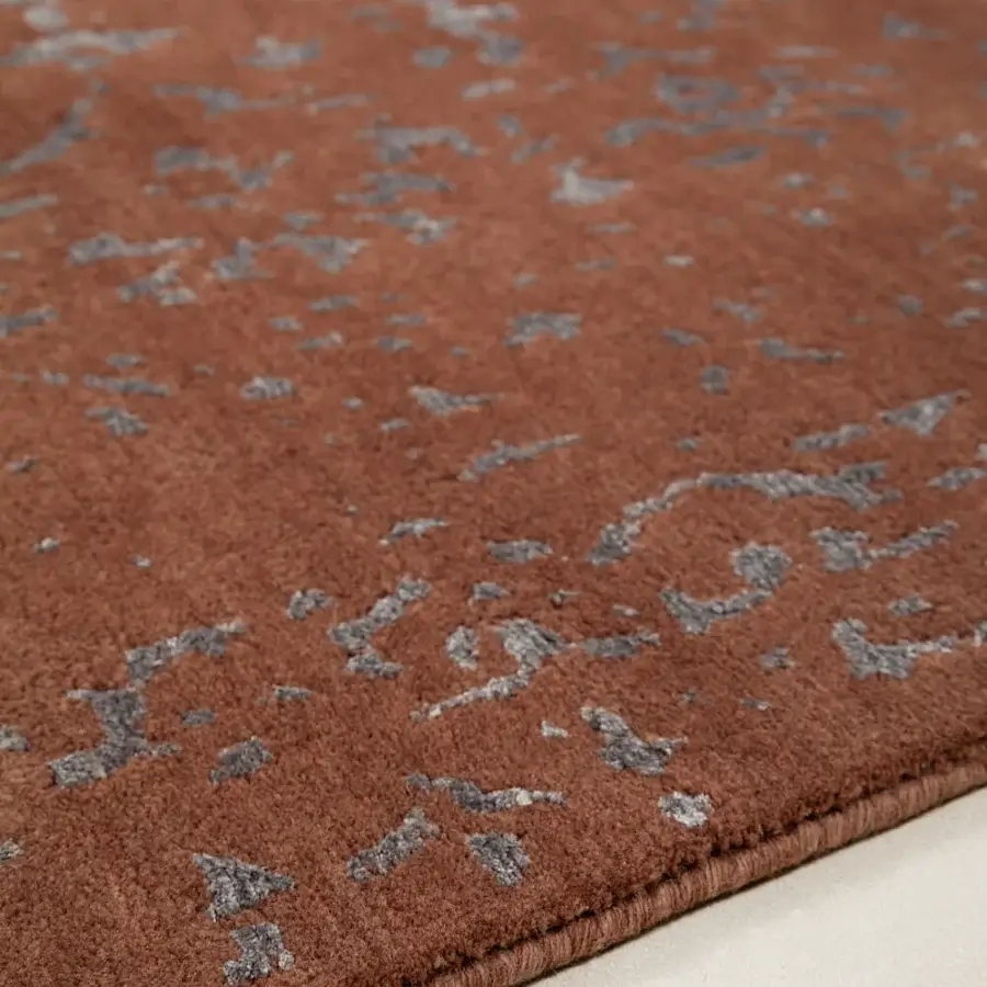 Lavish Amini Artemisia rug hand-knotted in India with terracotta and muted gray wool viscose pile exhibiting a clipped carved finish