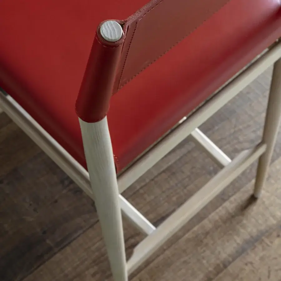 Meticulous Enrico Pellizzoni Ledermann counter stool with red leather upholstery and black technical fabric covering a sheet metal base