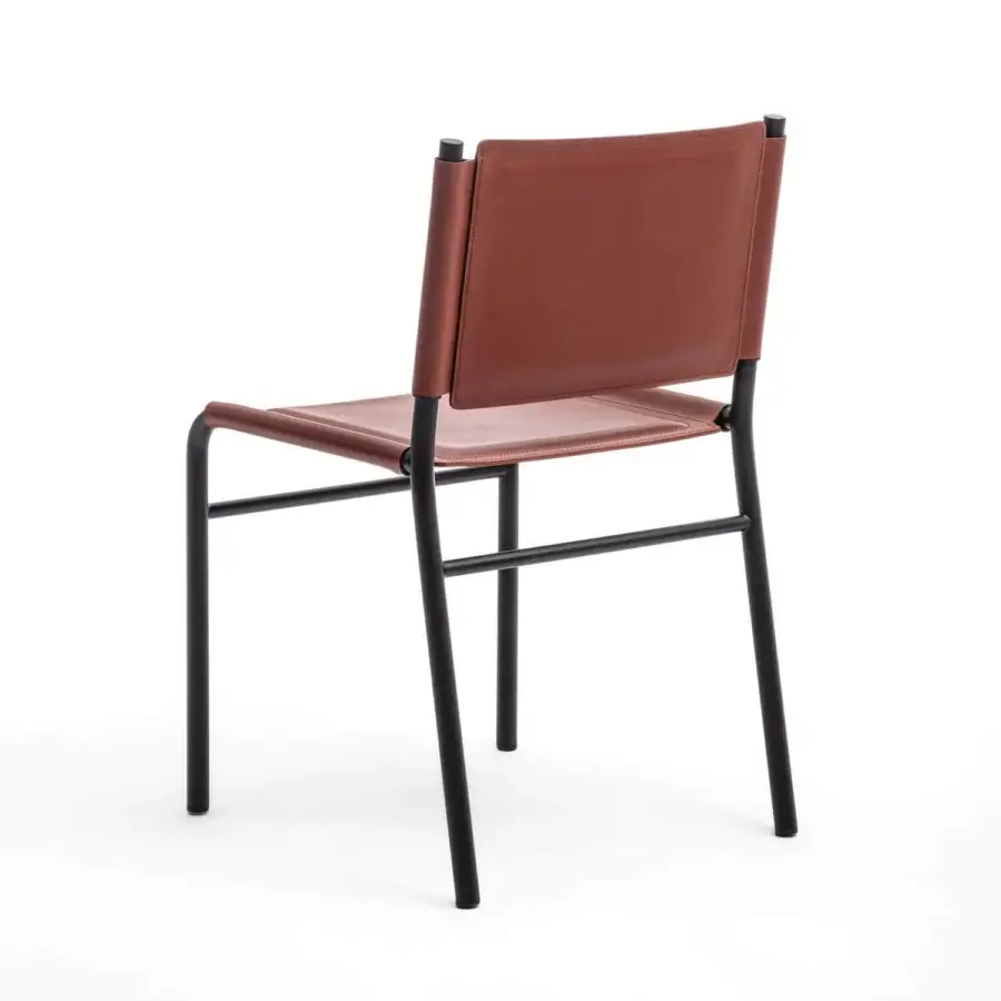 Distinguished Enrico Pellizzoni Pris chair with painted tubular metal frame and reddish-brown leather seat crafted with visible stitching