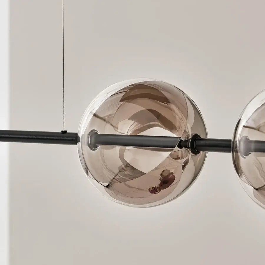 Elegant Bontempi Sferatus suspension lamp with warm amber borosilicate glass spheres and matte black metal rod crafted in Italy