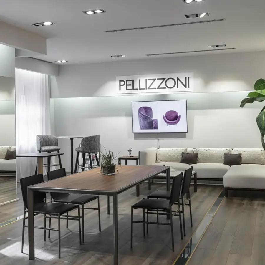 Superior Enrico Pellizzoni Elena chair with matte black tubular metal frame and dark leather upholstery creating a contemporary silhouette