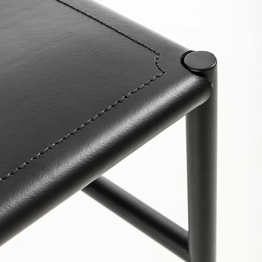Elegant Enrico Pellizzoni Elena chair with matte black tubular metal frame and supple leather upholstery crafted in Italy