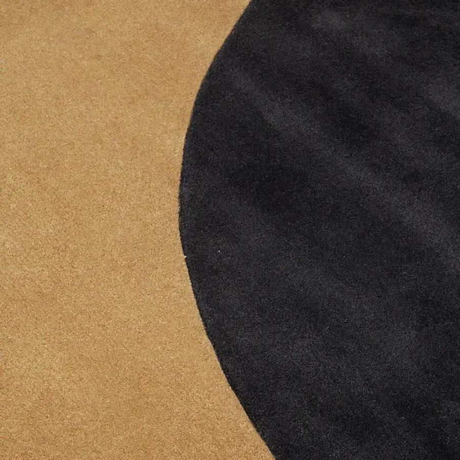 Superior Amini Teorema Hybrid rug hand-tufted with wool and tencel displaying charcoal black and golden-tan color blocking with a carved finish