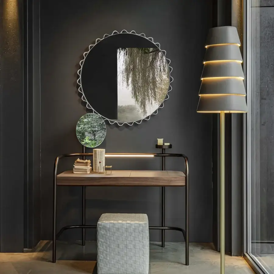 Exceptional Enrico Pellizzoni Glimt mirror with a wavy, leather-enveloped frame and bright brass studs in dark gray metal