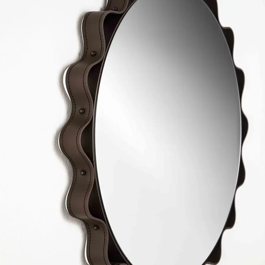 Exceptional Enrico Pellizzoni Glimt mirror with a round, wavy frame built in supple matte leather and bright brass studs