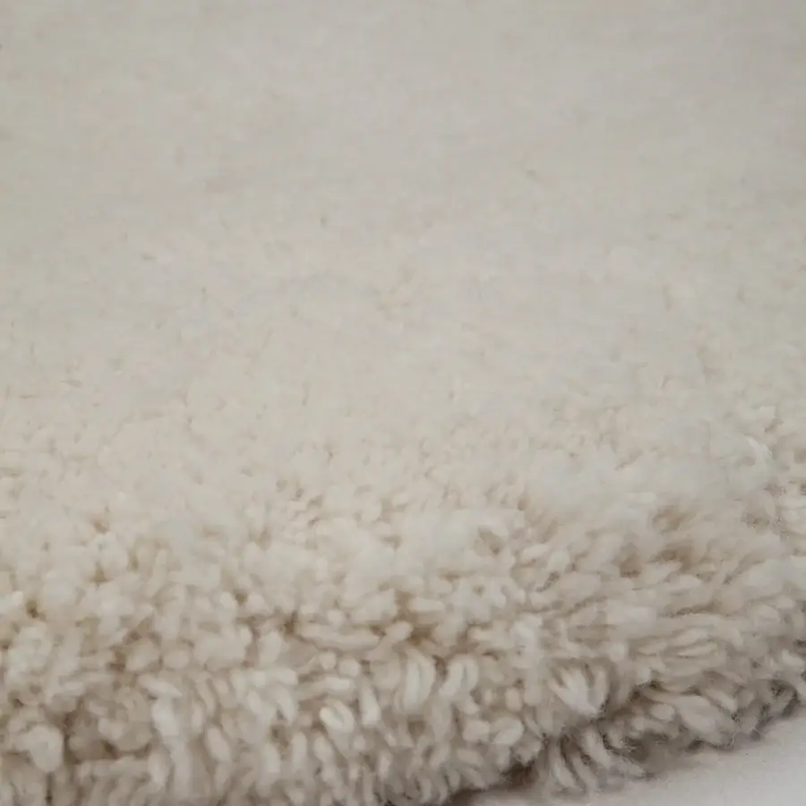 Exceptional Amini Ciclopi-Atollo rug hand-knotted in off-white pure organic wool with a subtly shaggy pile and carved finish