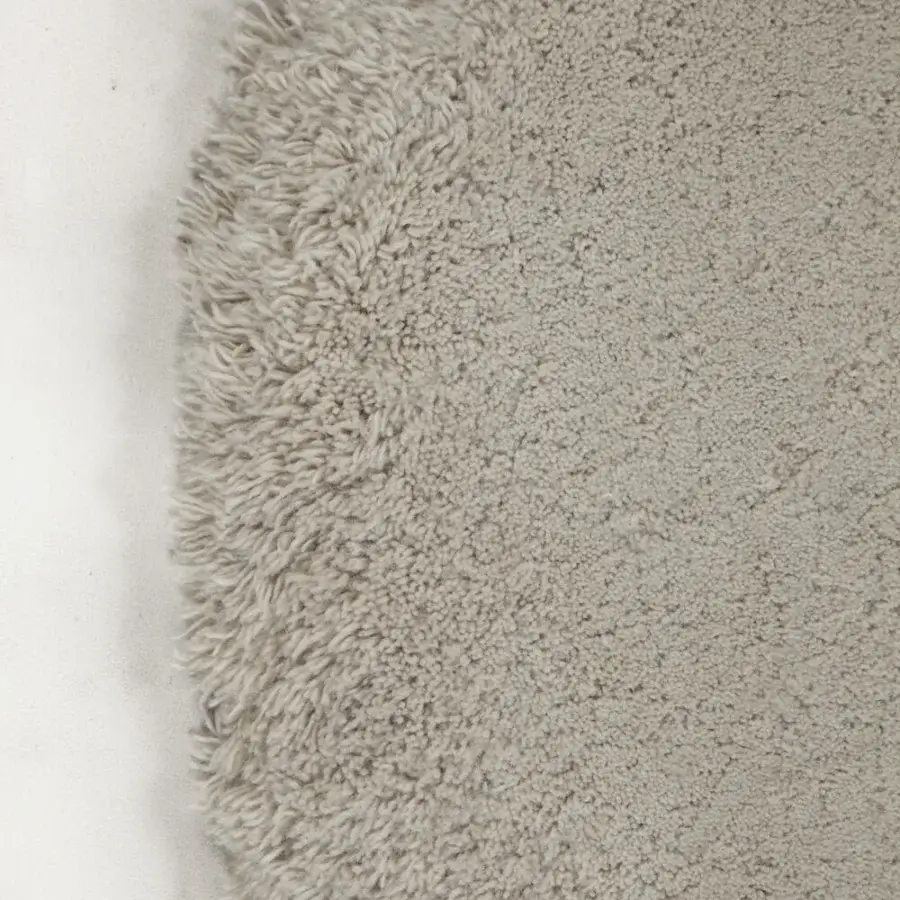 Superior Amini Ciclopi-Atollo rug hand-knotted in neutral beige pure organic wool with shaggy fringe finish