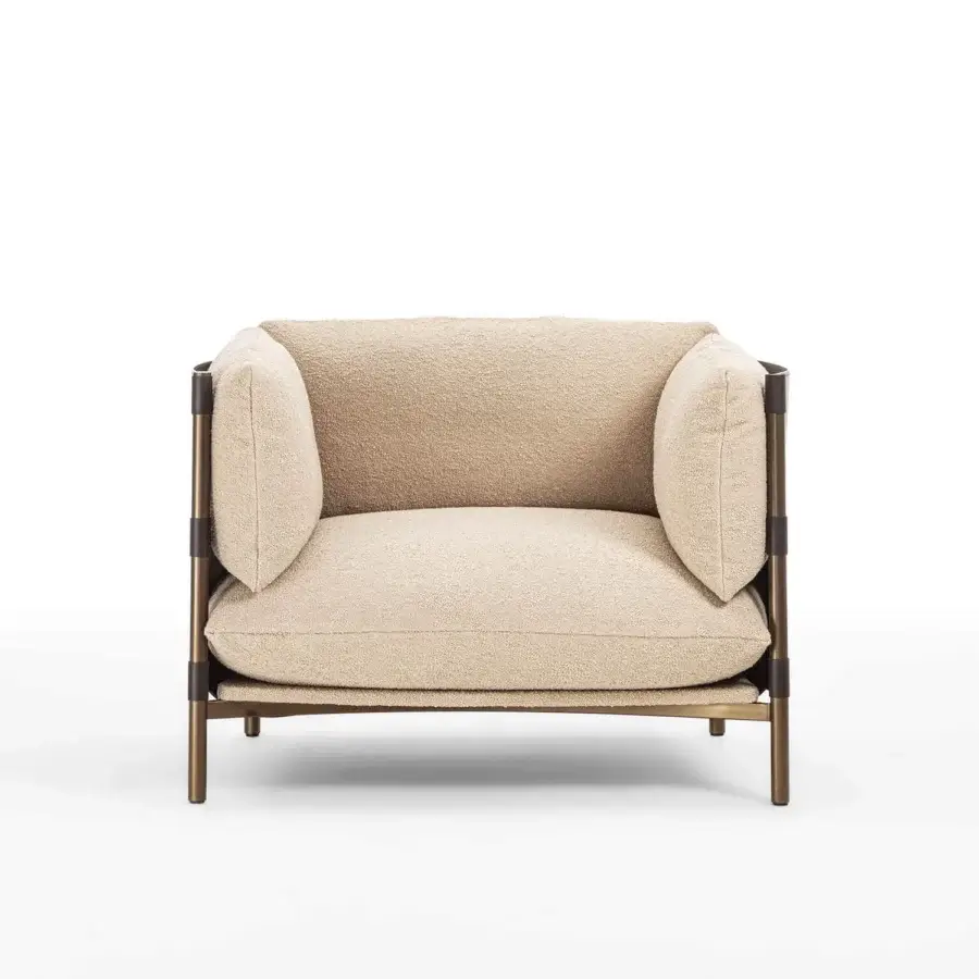 Refined Enrico Pellizzoni Iris lounge chair with textured neutral beige boucle upholstery and contrasting hard leather detailing