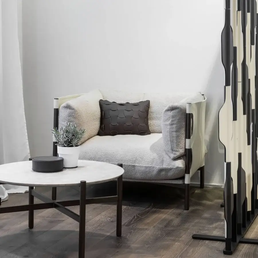 Distinguished Enrico Pellizzoni Iris lounge chair with light gray tubular metal and bouclé textile, built with a dark brown patterned seat cushion