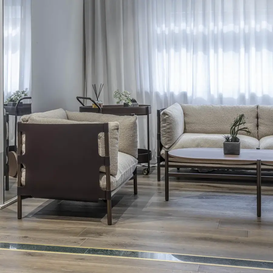 Exceptional Enrico Pellizzoni Iris lounge chair crafted with dark matte wood and textured neutral beige textile upholstery