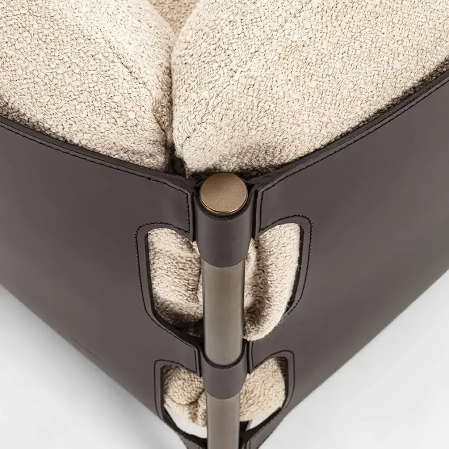 Refined Enrico Pellizzoni Iris lounge chair with a dark satin frame and light beige textured textile upholstery