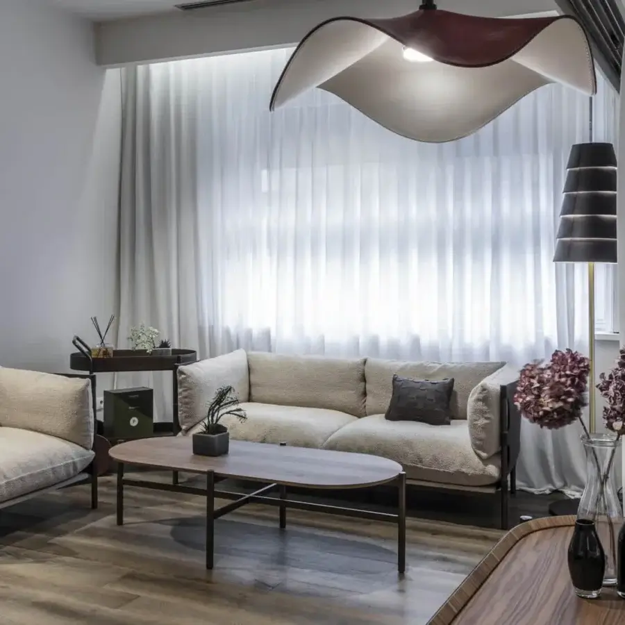 Exceptional Enrico Pellizzoni Iris sofa with leather armrests, textured beige textile and dark wood legs built with a metal support