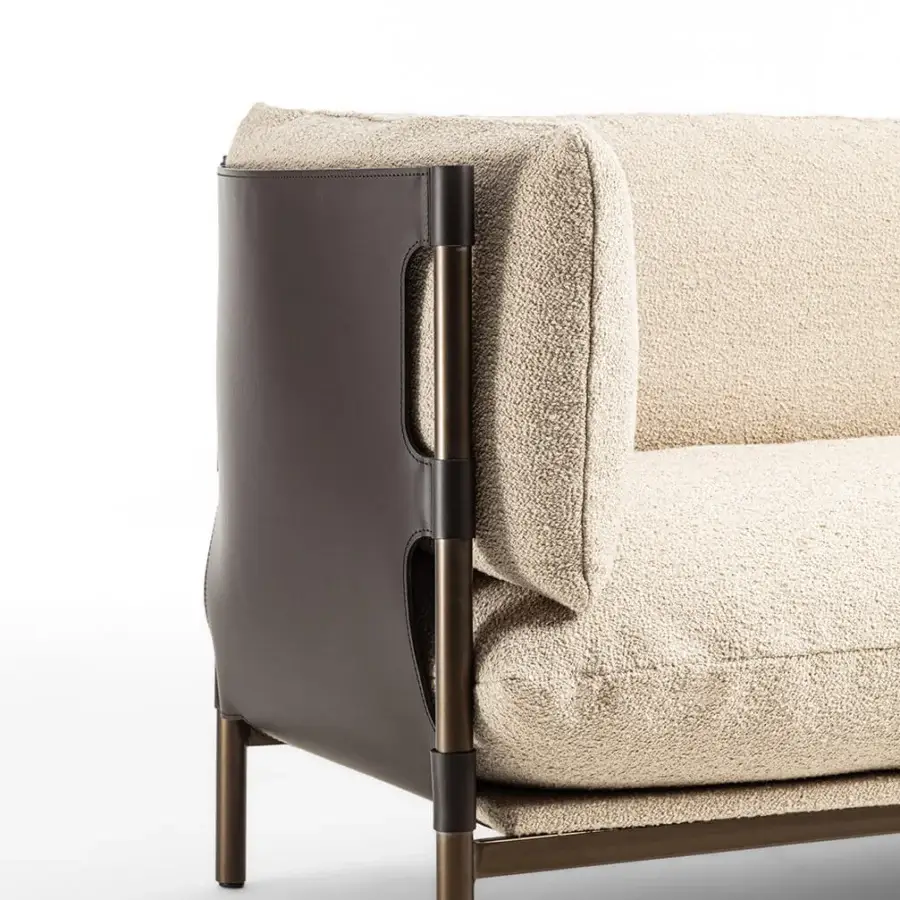 Sophisticated Enrico Pellizzoni Iris sofa built with creamy beige textile upholstery and dark brown leather detailing