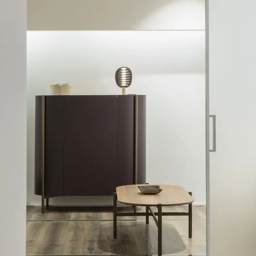 Exceptional Enrico Pellizzoni Iris Cupboard with dark muted brown leather upholstery and sleek metal base with integrated lighting
