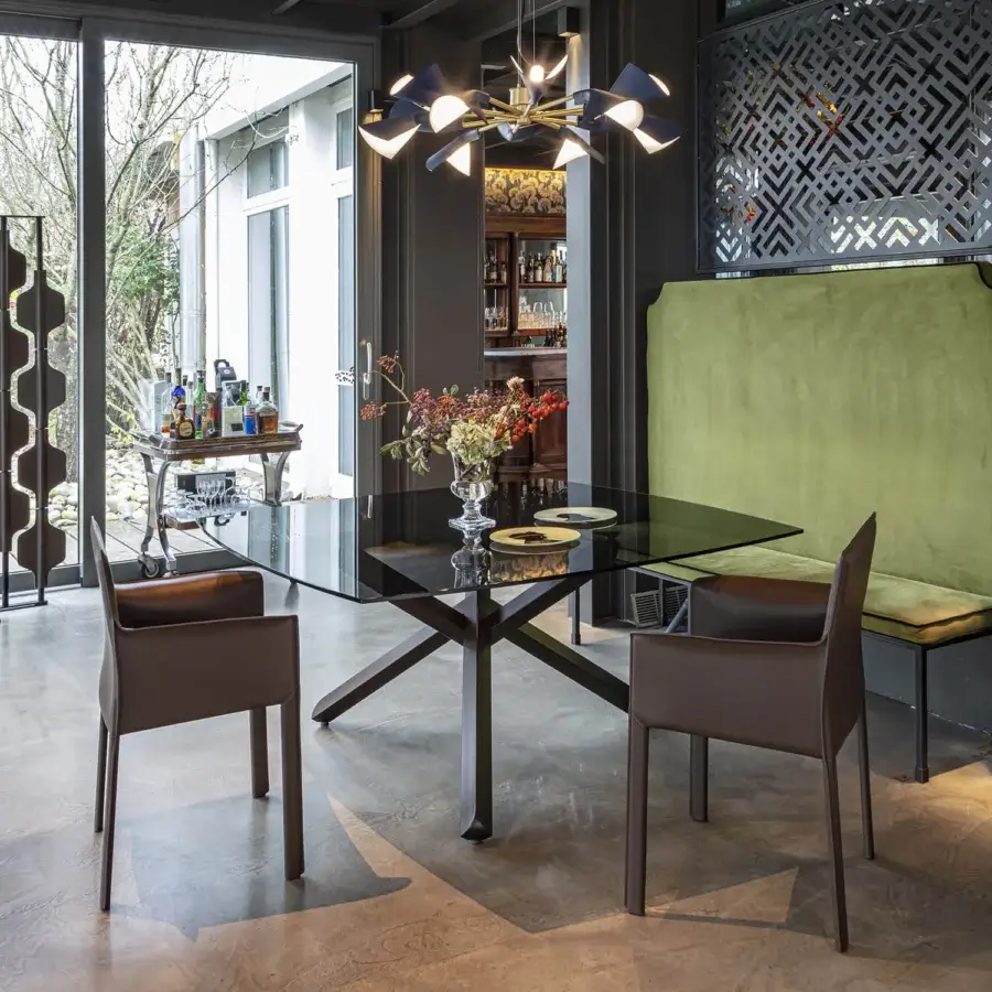 Meticulous Enrico Pellizzoni Pasqualina armchair with fully leather-covered structure and expert visible stitching in a warm medium-brown hue