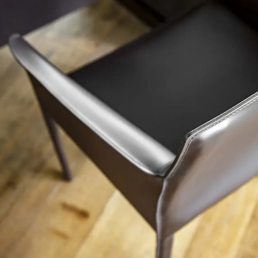 Distinguished Enrico Pellizzoni Pasqualina armchair with dark charcoal gray leather and expertly visible stitching