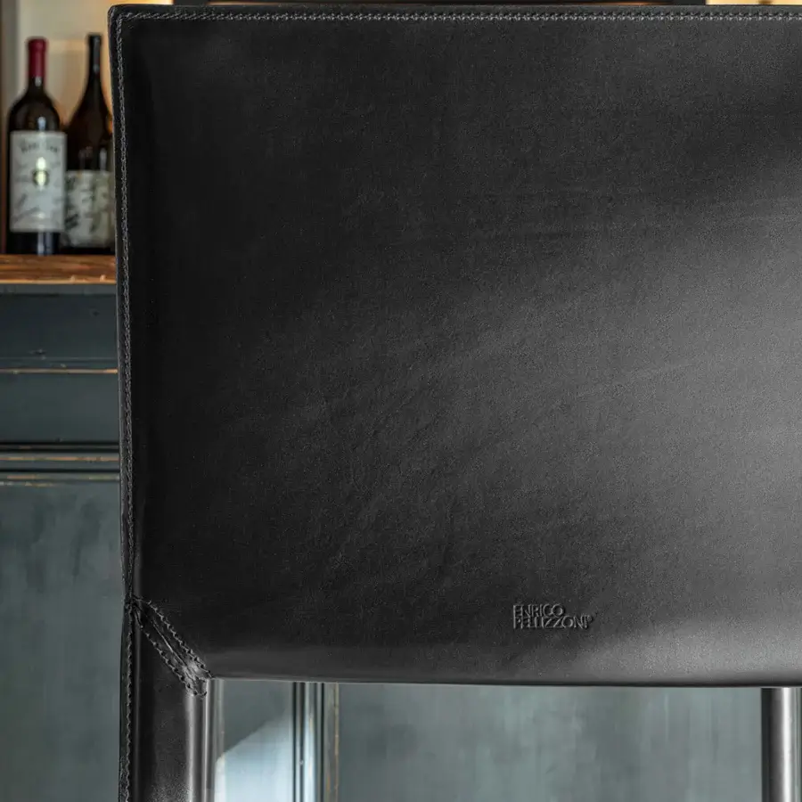 Distinguished Enrico Pellizzoni Pasqualina counter stool crafted in black leather with exposed stitching, exhibiting Italian design