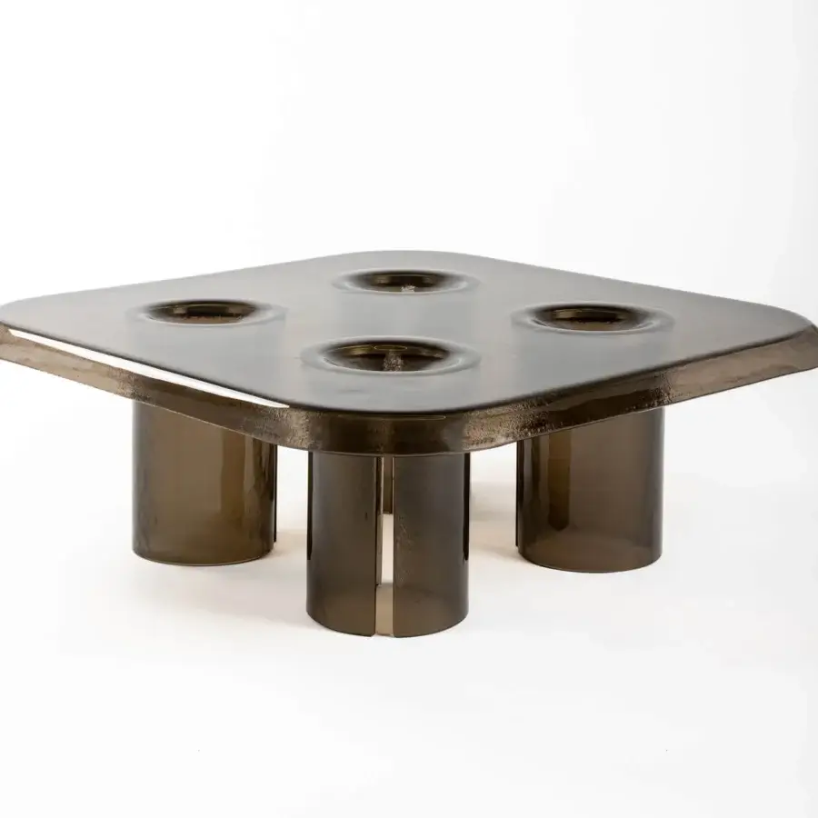 Distinguished Driade Coupelle coffee table crafted in brownish-grey transparent resin with undulating tabletop and integrated cylindrical legs