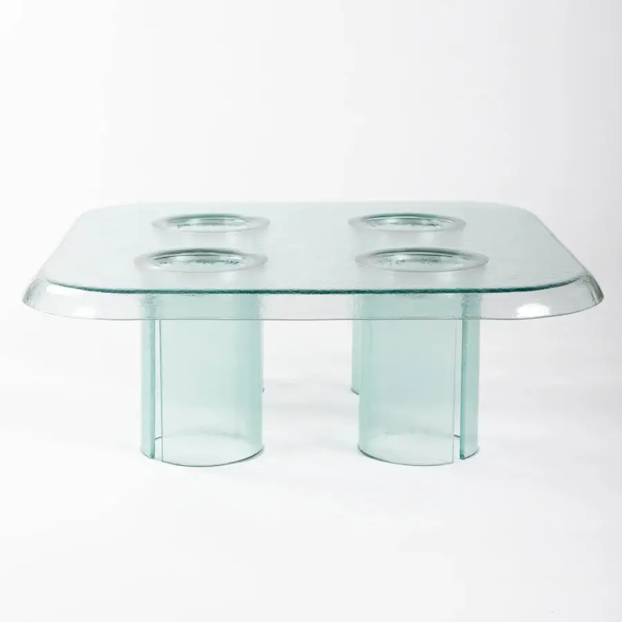 Elegant Driade Coupelle coffee table crafted in pale green-blue thermoformed glass with integrated indentations and cylindrical legs