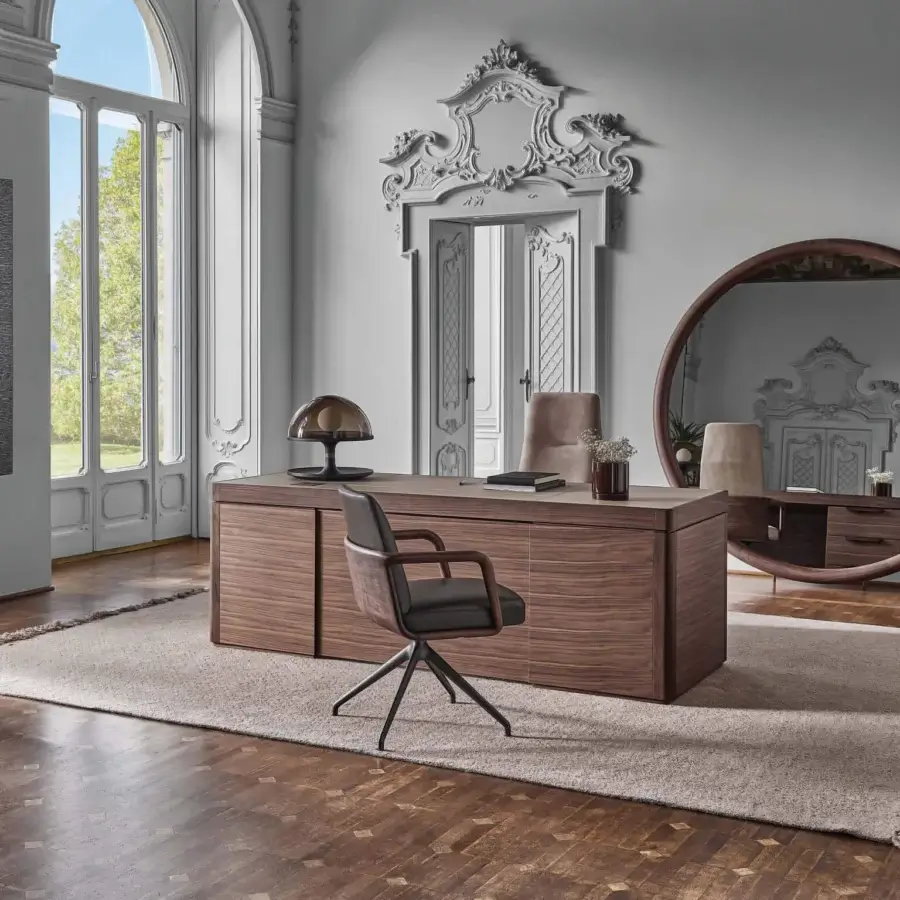 Elegant Porada Agea desk crafted with solid canaletta walnut and satin finish, offering three drawers lined with Cuoietto and integrated outlets