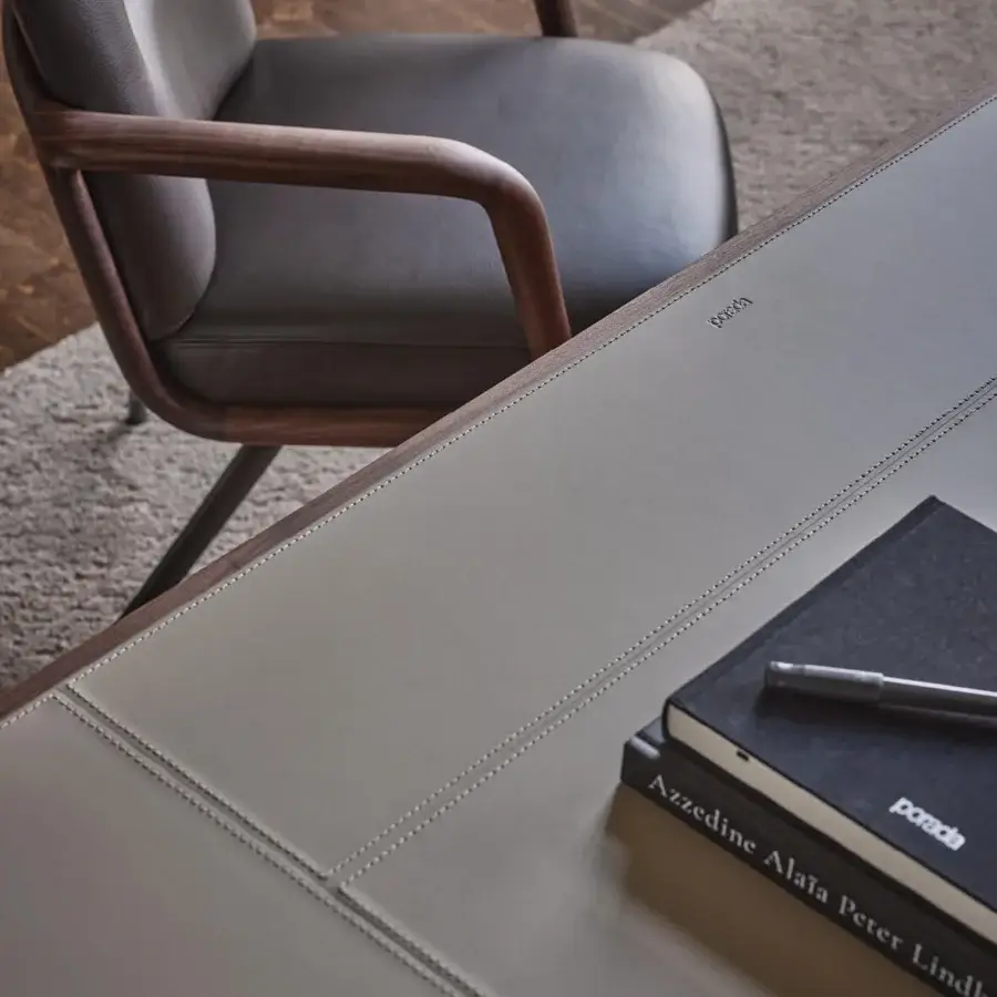 Elegant Porada Agea desk built with solid canaletta walnut and a Cuoietto saddle leather top in pale beige hues