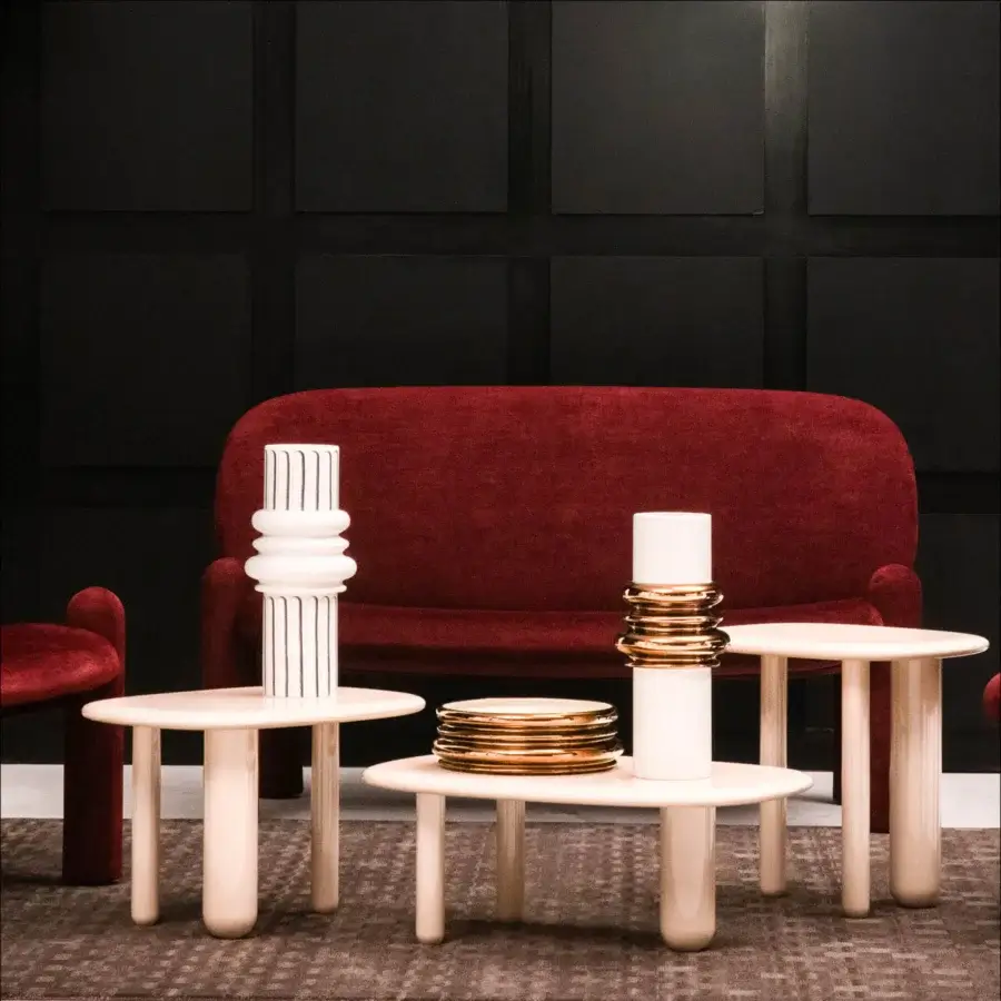 Elegant Driade Tottori coffee table with softly contoured tabletop and gently curved legs in pale beige wood with brushed glossy lacquer