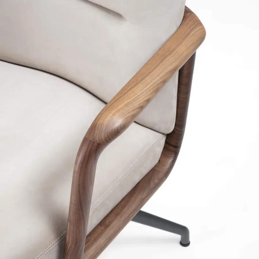 Elegant Porada Cuna swivel chair with curved Canaletta walnut backrest and light neutral upholstery in satin finish