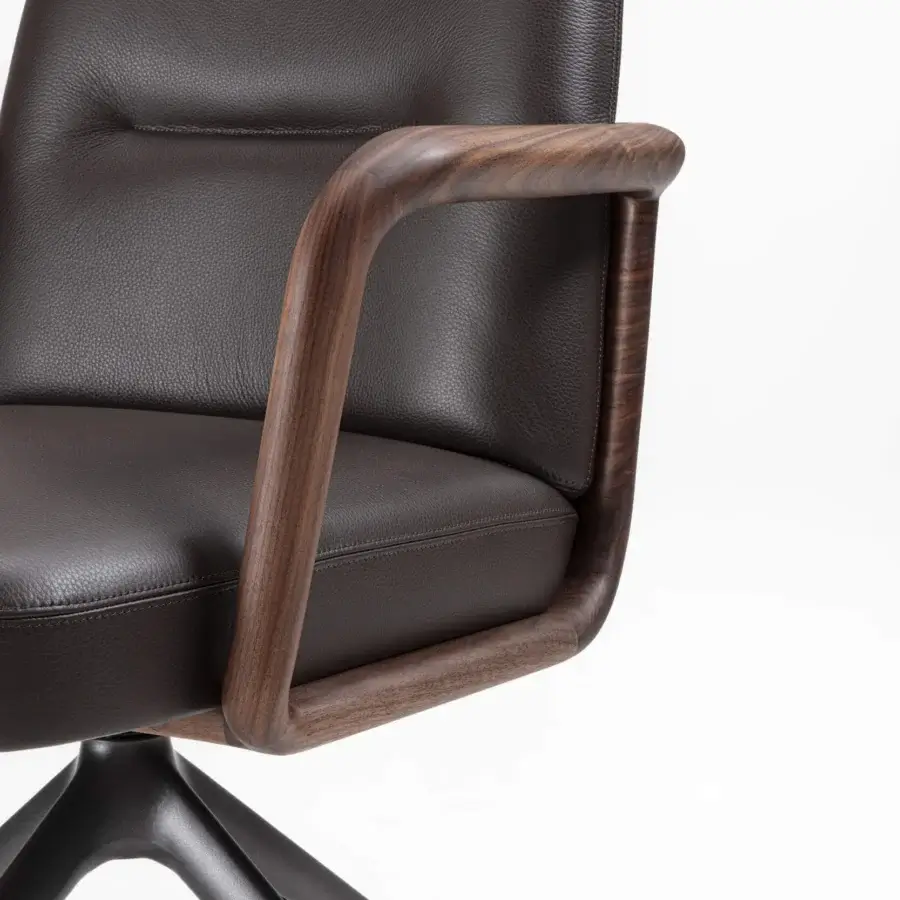 Elegant Porada Cuna swivel chair with sculpted Canaletta walnut frame and dark brown leather-like upholstery in satin finish