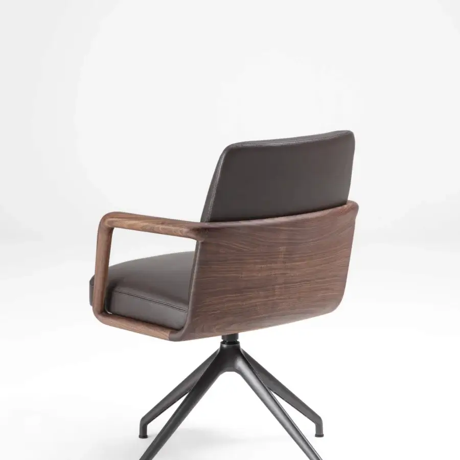 Distinguished Porada Cuna swivel chair with sculpted Canaletta walnut backrest and flowing armrests in dark textile with matte black base