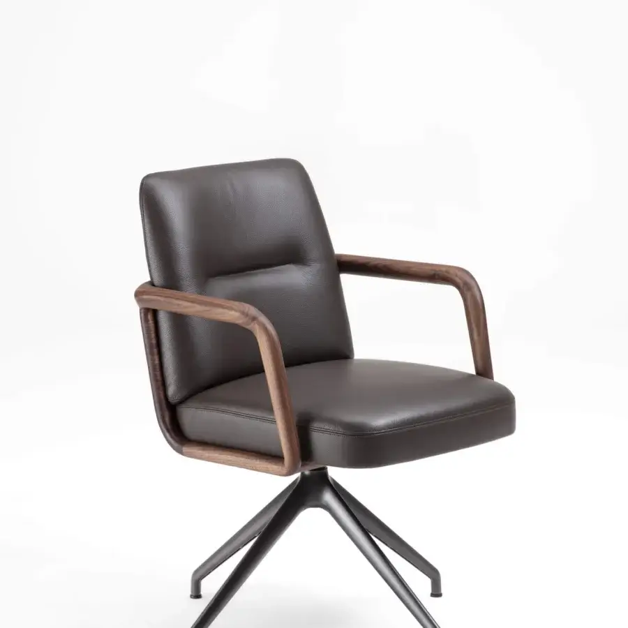 Superior Porada Cuna swivel chair with sculpted Canaletta walnut frame and deeply textured leather upholstery in satin finish