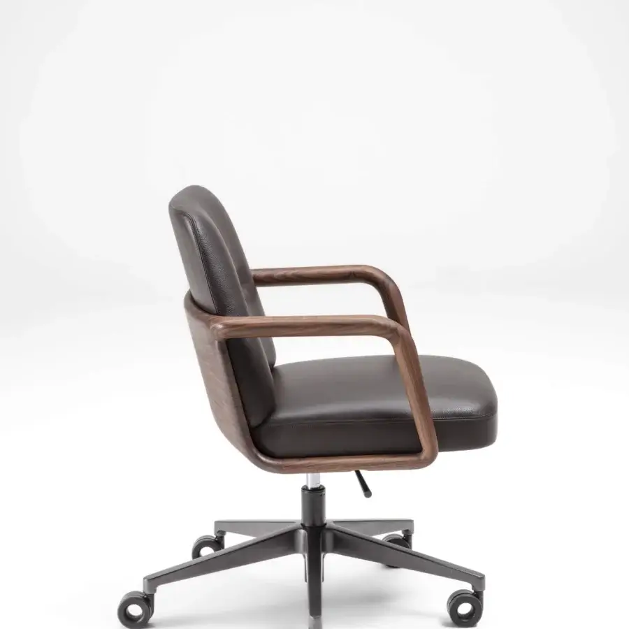 Exceptional Porada Cuna swivel chair built with sculpted solid Canaletta walnut in satin finish and dark upholstery