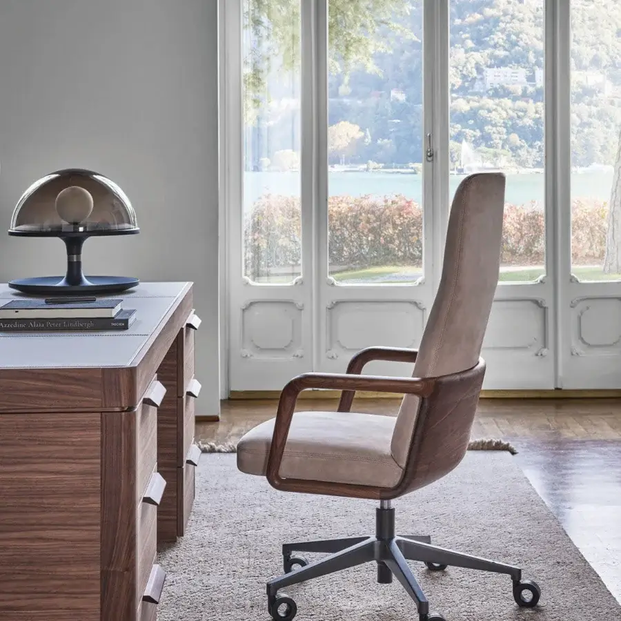 Distinguished Porada Cuna swivel chair with sculpted solid Canaletta walnut frame and inviting light beige upholstered seat
