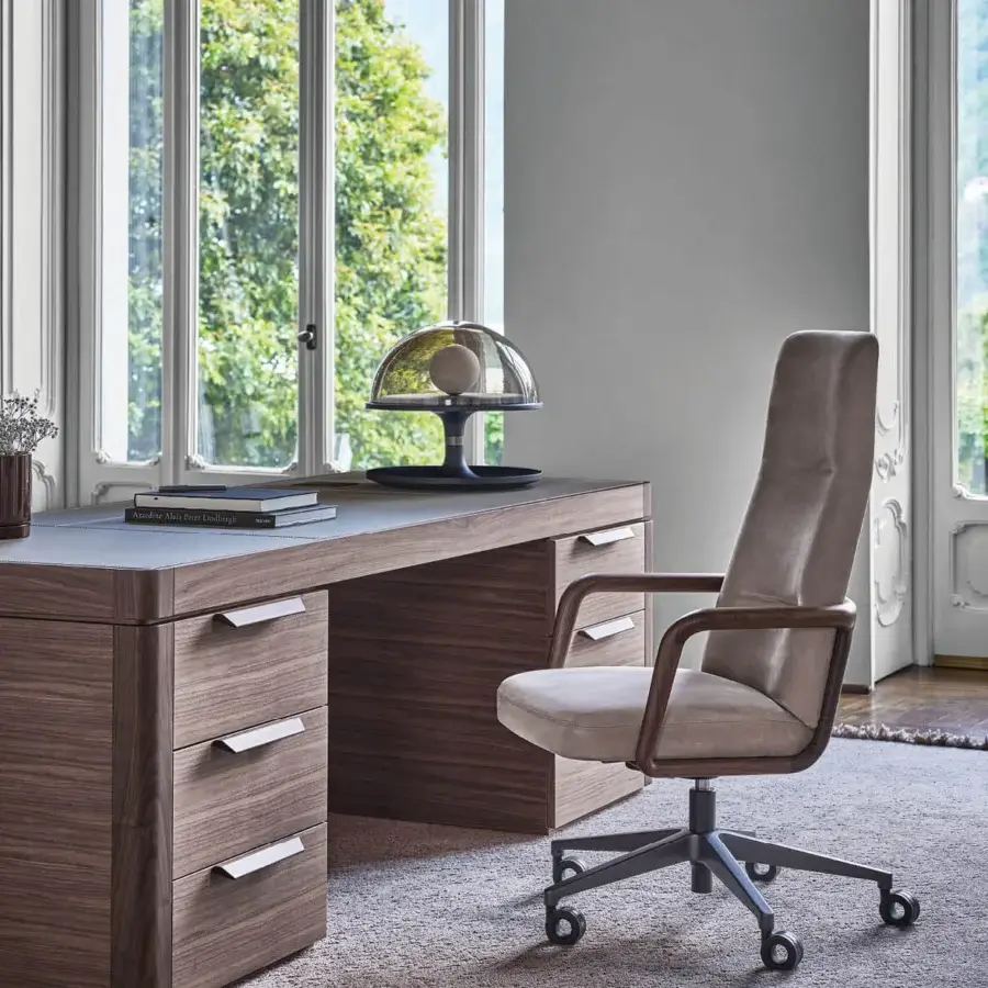 Exceptional Porada Cuna swivel chair crafted with sculpted solid Canaletta walnut and light beige textile upholstery with dark gray polished metal finish