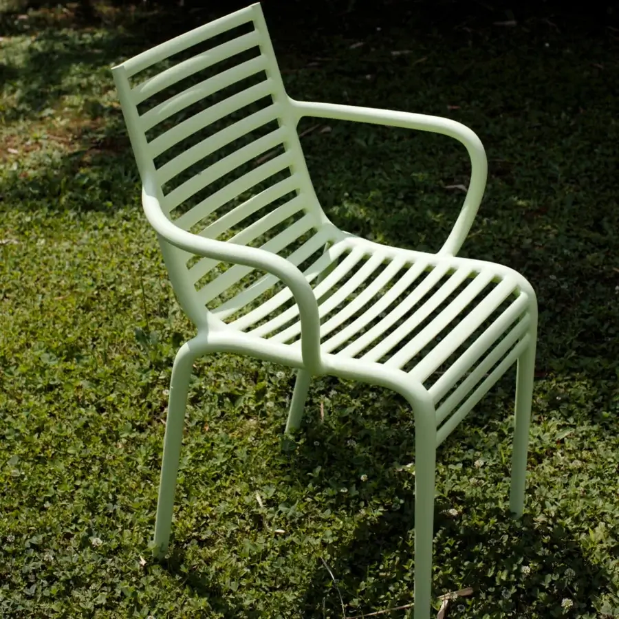 Distinctive Driade Pip-e chair crafted in pale green polypropylene with a striking chiaroscuro effect from horizontal slats