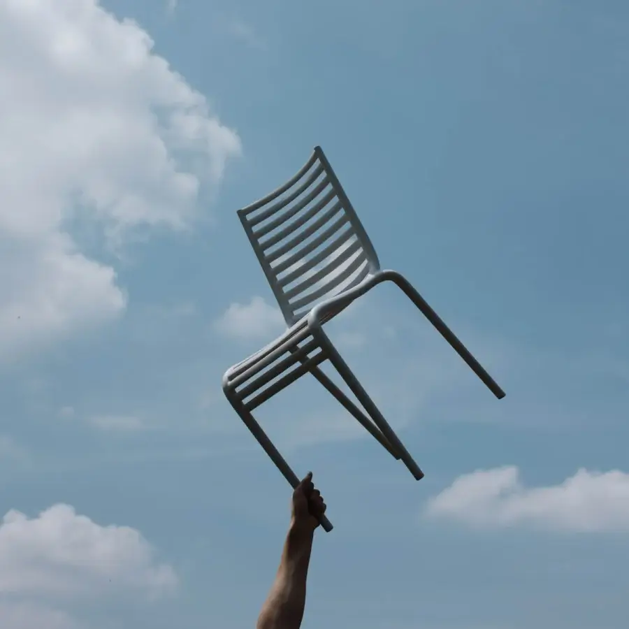 Superior Driade Pip-e chair built in light gray polypropylene with a smooth matte finish and horizontal slats