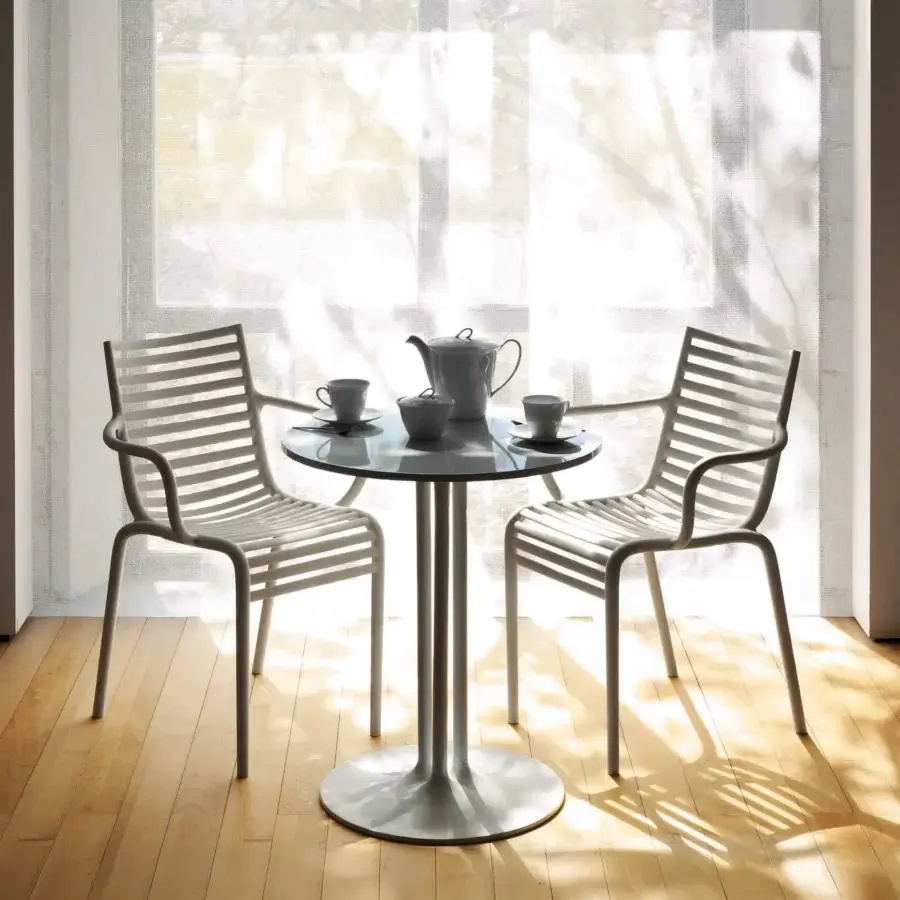 Elegant Driade Pip-e chair built in gray polypropylene with a sleek metal frame and subtly curved horizontal slats