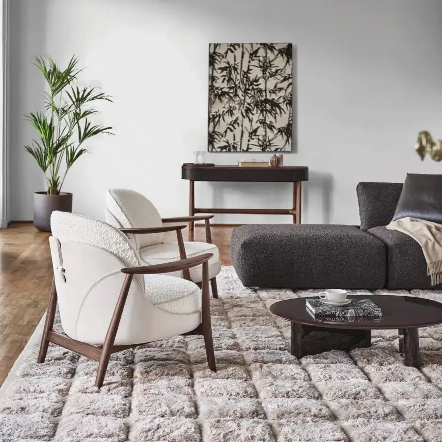 Exceptional Porada Ginkgo XL lounge chair with cream bouclé upholstery and a satin Canaletta walnut frame