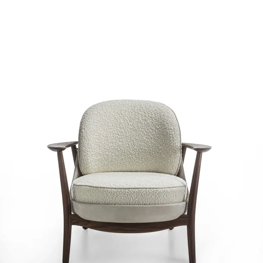 Distinguished Porada Ginkgo XL lounge chair crafted with Canaletta walnut and textured off-white bouclé fabric, exhibiting refined details