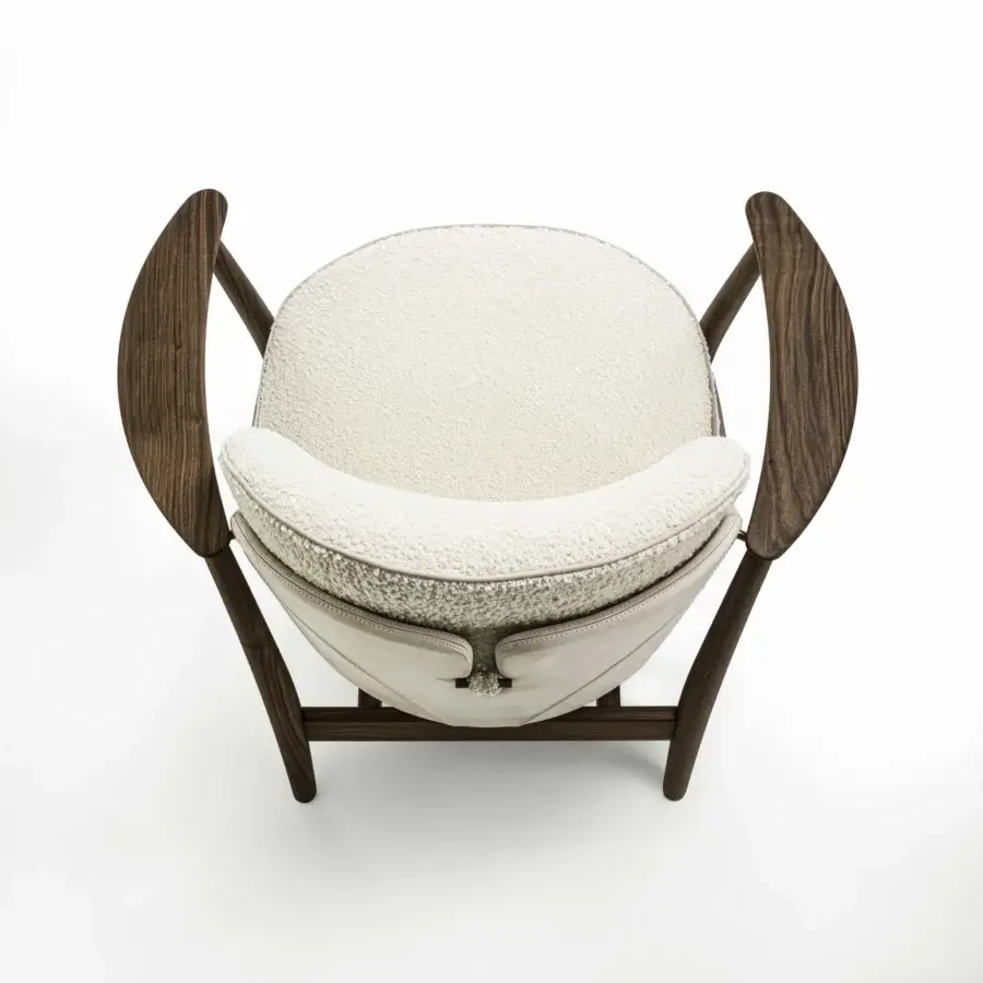 Distinguished Porada Ginkgo XL lounge chair crafted with Canaletta walnut and upholstered in textured off-white bouclé-like textile