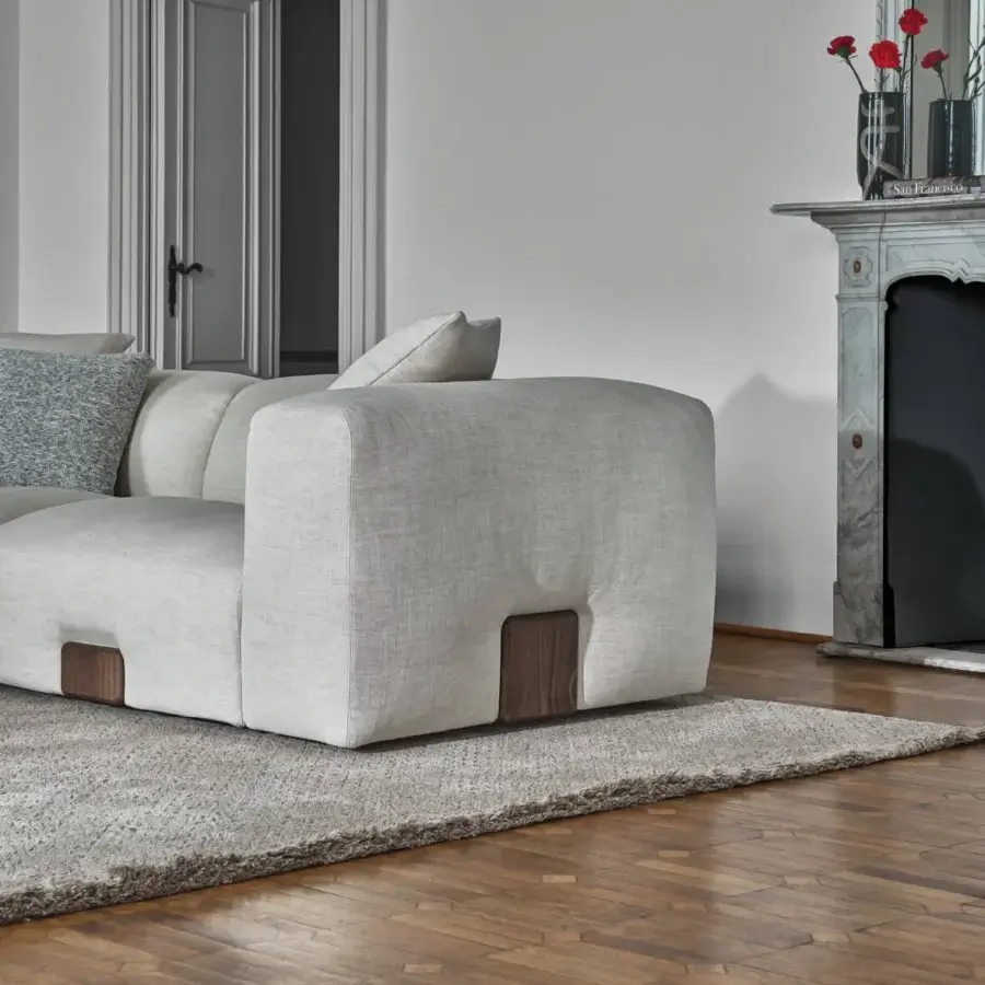 Superior Porada Koji sofa with light gray textile upholstery and solid Canaletta walnut detailing crafted in multilayer wood