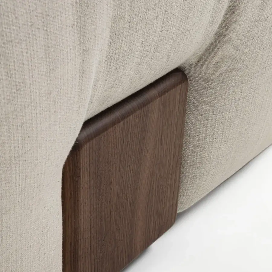 Distinctive Porada Koji sofa with neutral beige textile upholstery and recessed solid Canaletta walnut legs in satin finish