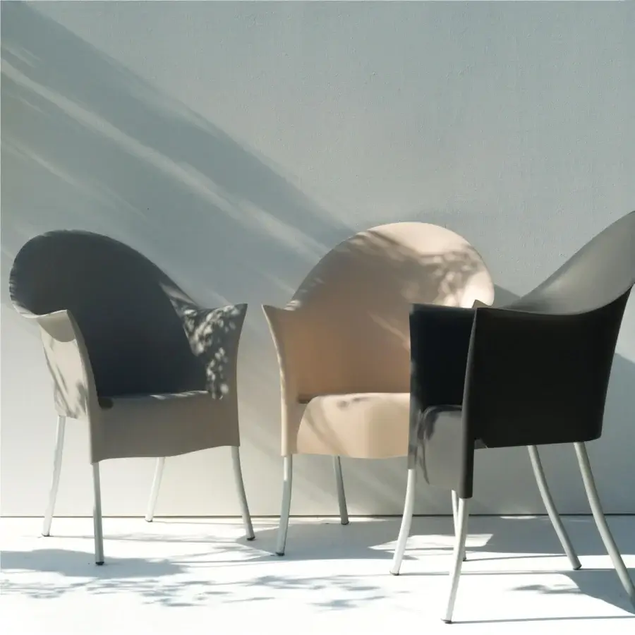 Elegant Driade Lord Yo armchair with organic curved form and warm beige molded polypropylene shell built with refined aluminum