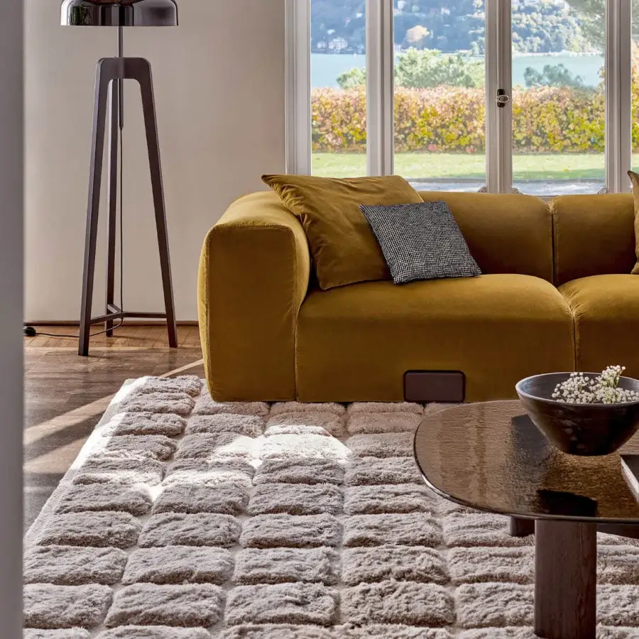 Sophisticated Porada Koji sectional in warm golden-yellow textured textile with solid Canaletta walnut detail