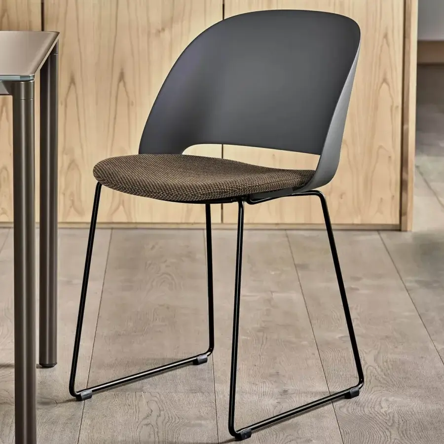 Elegant Bontempi Polo chair with dark gray shell and mottled brown beige seat cushion built with a black metal sled base