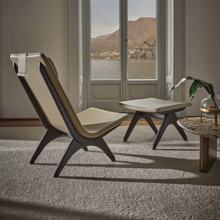 Lavish Porada Koko lounge chair crafted with Canaletta walnut and light beige textile upholstery with black chrome detailing