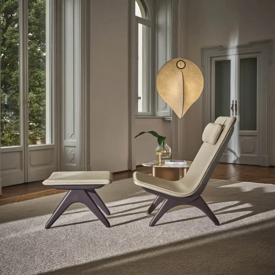 Superior Porada Koko lounge chair with Canaletta walnut frame and light beige molded polyurethane upholstery with black chrome details