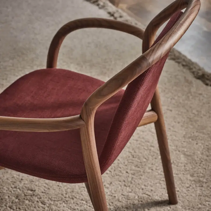 Lavish Porada Petra chair built in solid Canaletta walnut with reddish-brown upholstery and satin finish