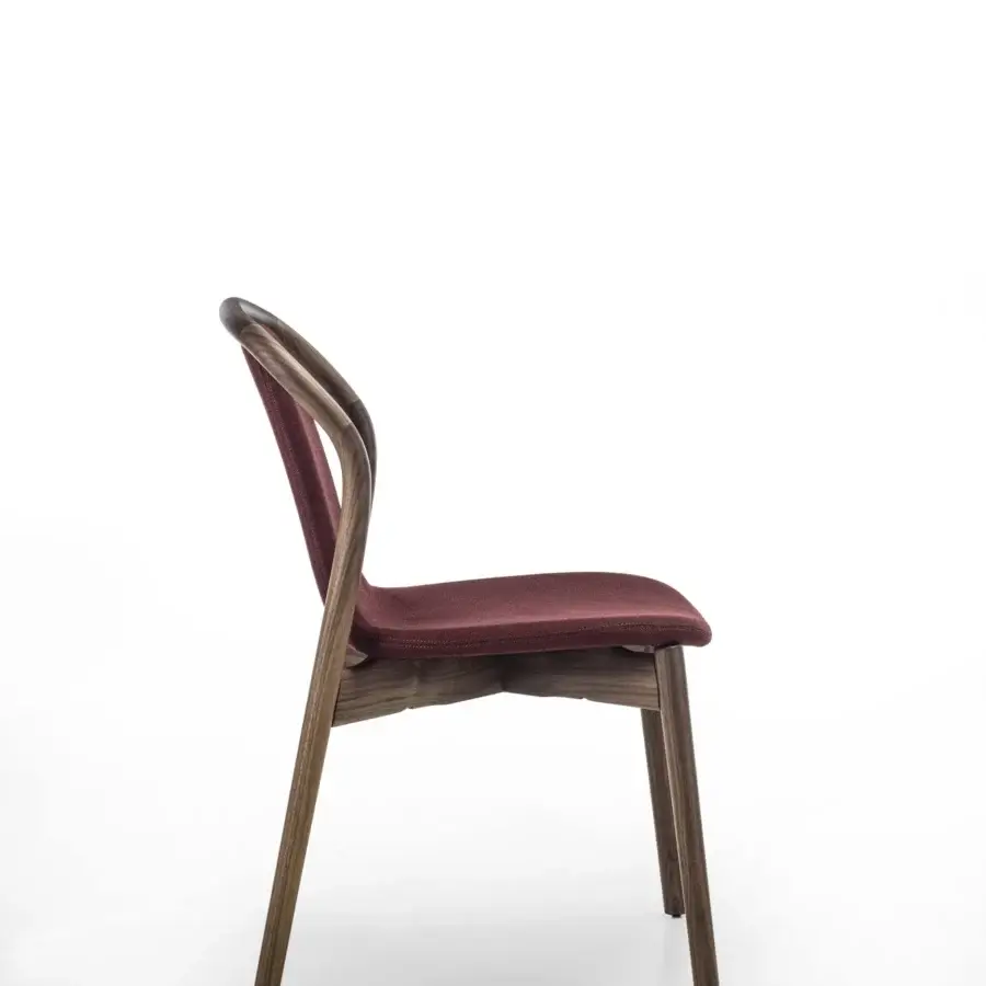Elegant Porada Petra chair with solid Canaletta walnut frame and subtly flexible burgundy textile upholstery