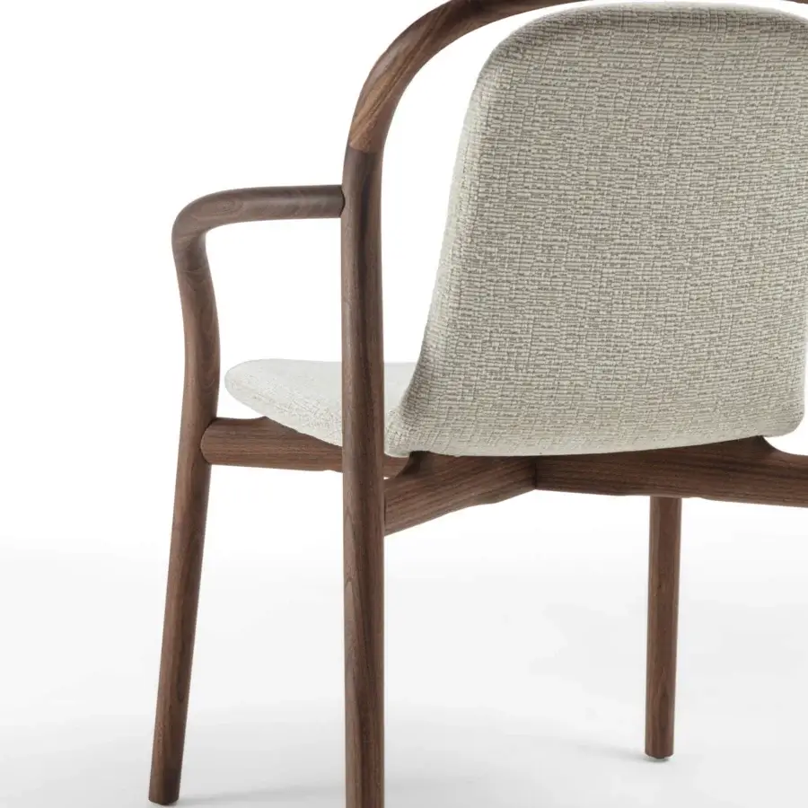 Distinguished Porada Petra chair with solid Canaletta walnut frame and subtly textured light-beige upholstery in satin finish