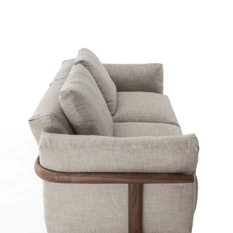 Exceptional Porada Ronny sofa with sculpted form, inviting beige textile upholstery and smooth dark brown wooden frame